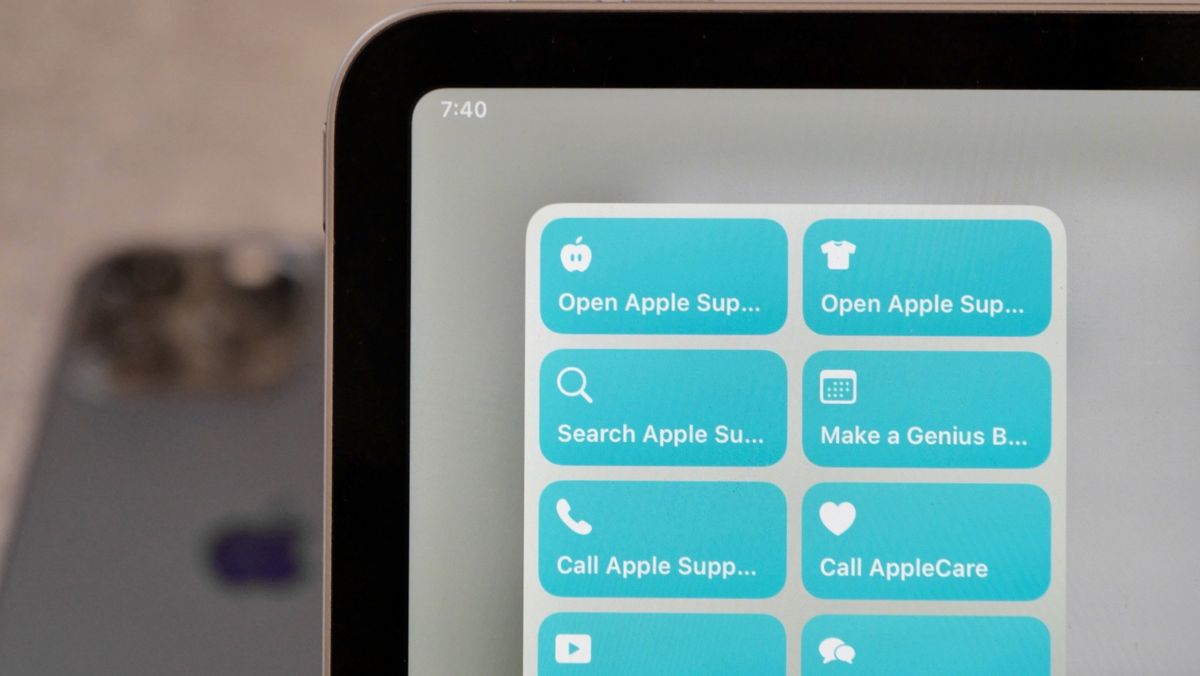 Photo of the linked Apple Support shortcuts in a large widget on the iPad, with an iPhone showing in the background.