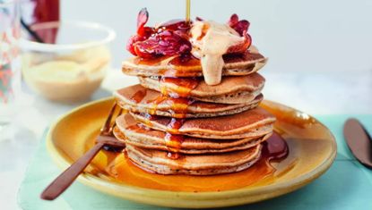 Joe Wicks stacked pancakes with bacon and maple syrup