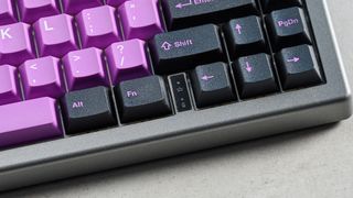 A black and purple Epomaker EK68 wireless mechanical keyboard