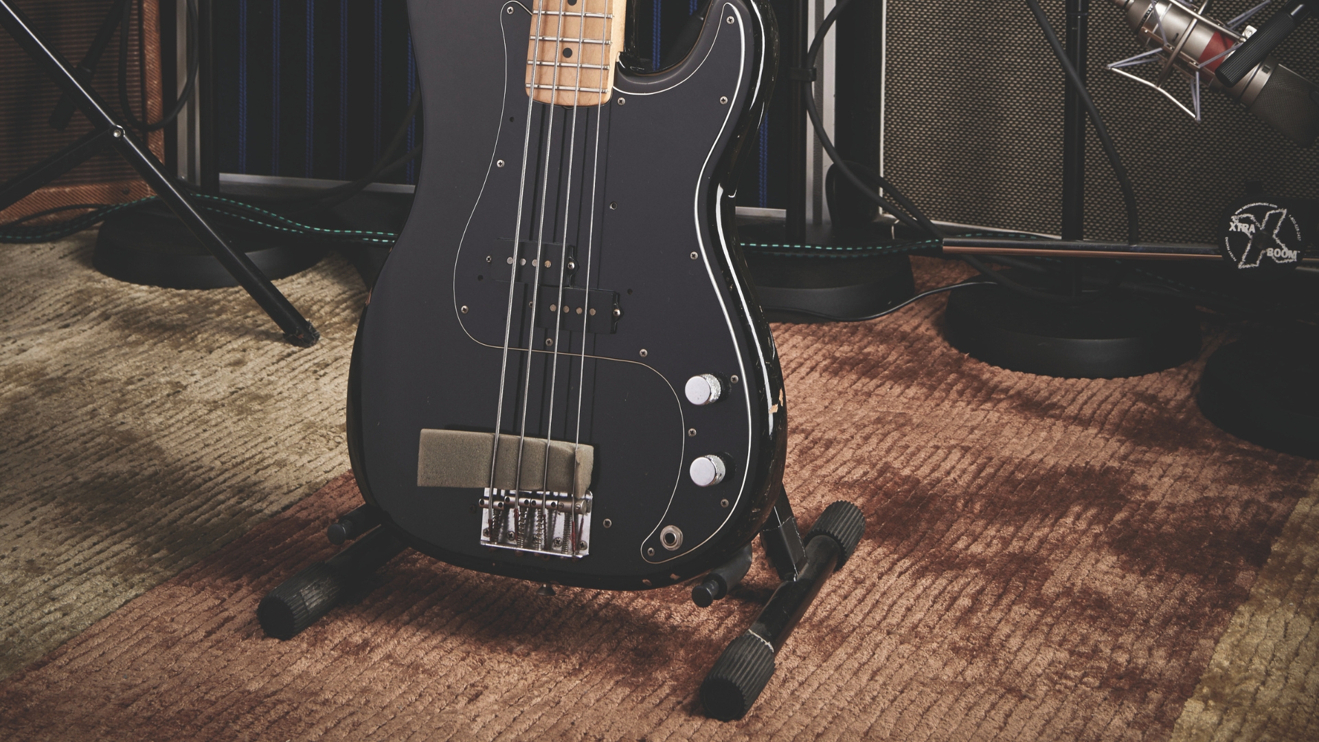 A bass guitar on an A-frame stand