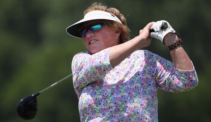 Carner hits a tee shot with a driver