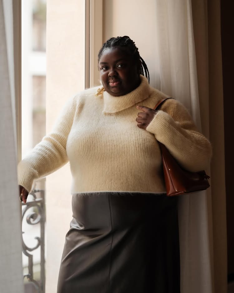 Classic Pieces 2025: @abimarvel wears a yellow jumper and a black leather pencil skirt