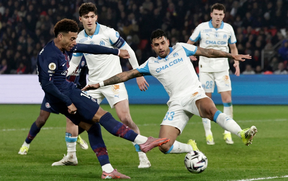 PSG's Desire Doue takes a shot against Marseille in Ligue 1