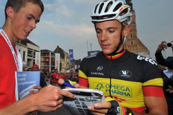 Gilbert signs an autograph