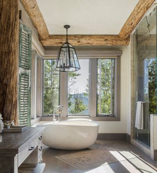 A bathroom with wooden logs