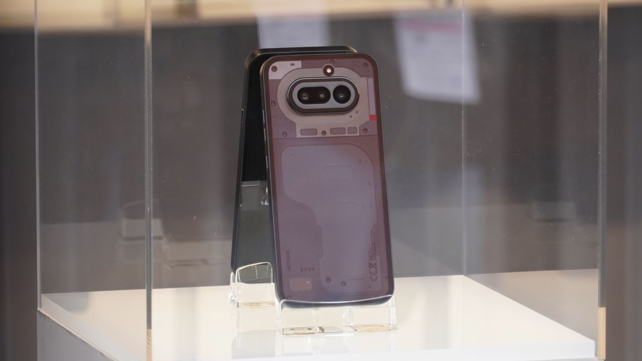 The Nothing Phone 4a on display at MWC 2026 in Black, White, Blue, and Pink colorways.