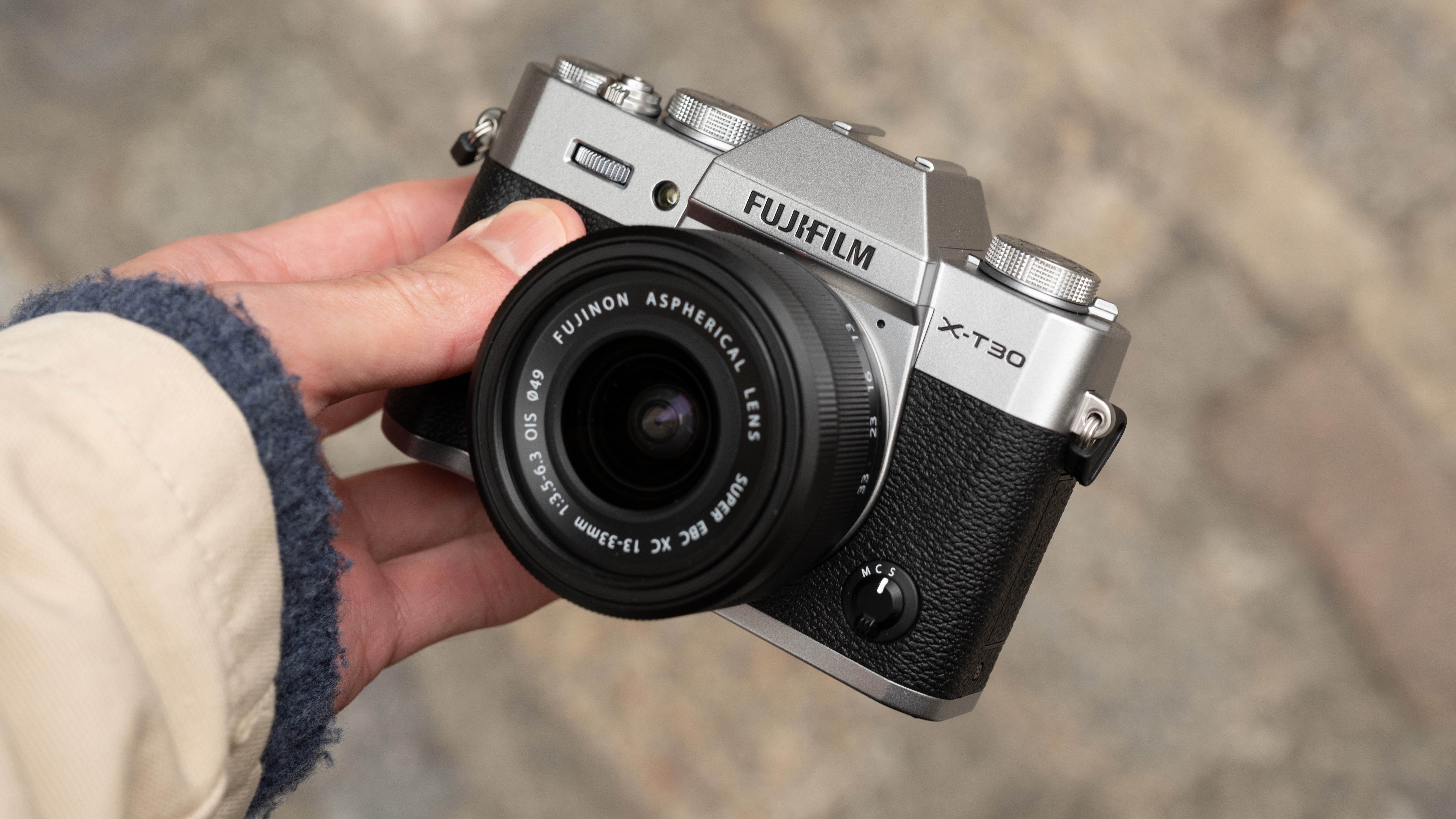 Fujifilm X-T30 III camera held in a hand