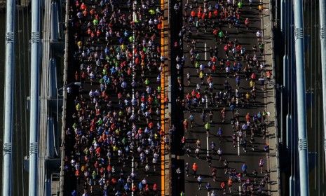 Runners cross the Verrazano-Narrows Bridge toward Brooklyn at the start of the 2011 New York City marathon