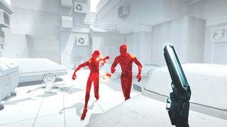 A player holding a gun and shooting two red enemies in the game Superhot.