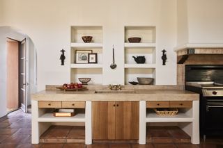 A kitchen with a neutral palette and wooden features