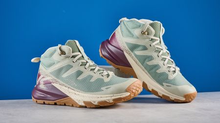 Keen Targhee Apex Mid in color Lily Pad/Fig photographed in front of a blue background