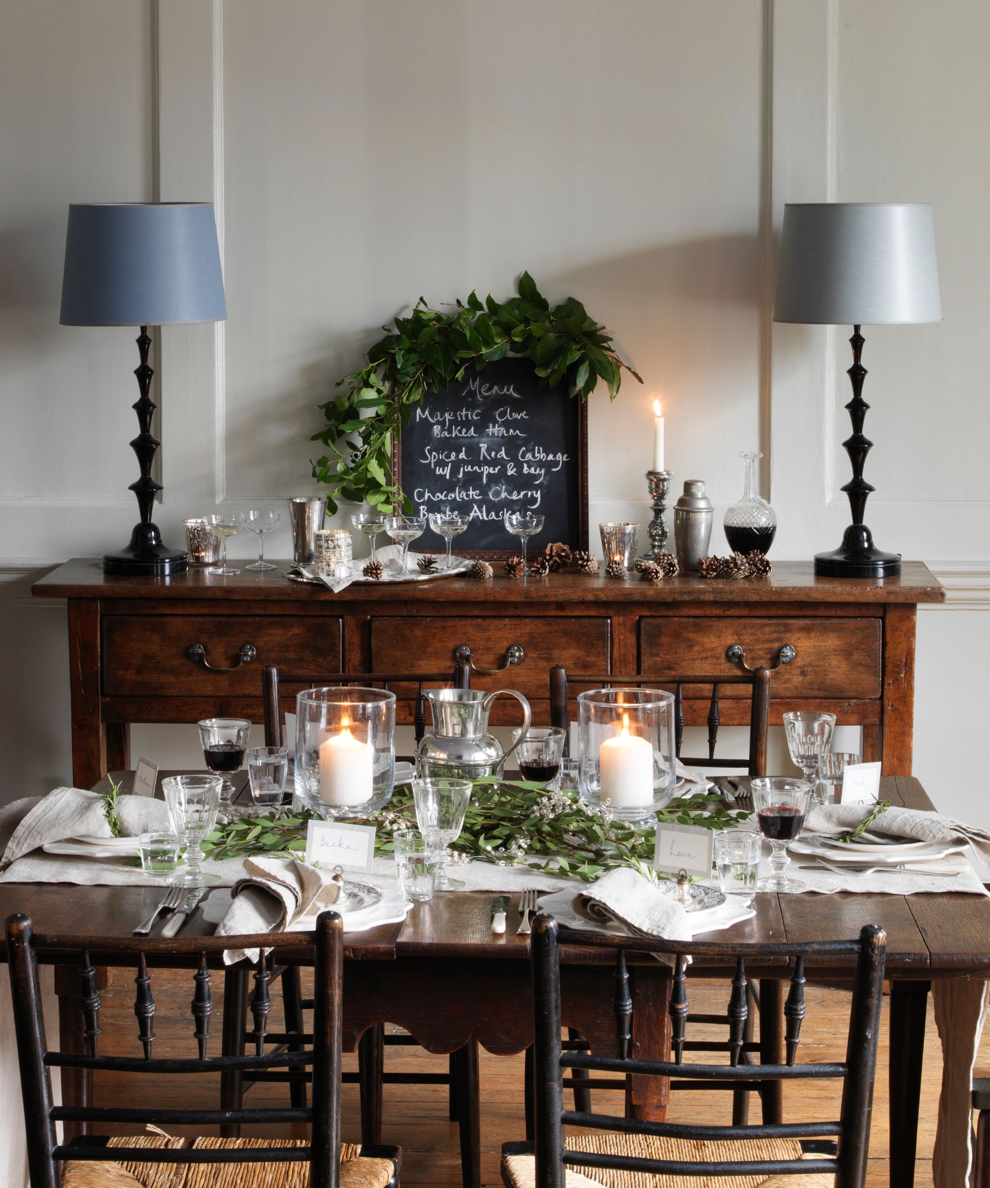 Natural Christmas table with white linens and greenery