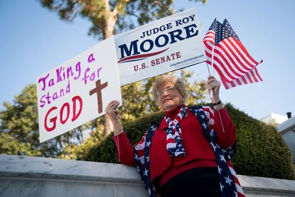 A woman supports Roy Moore