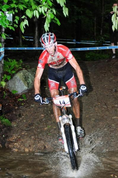 Geoff Kabush (Team Maxxis-Rocky Mountain) crossing a stream in second place