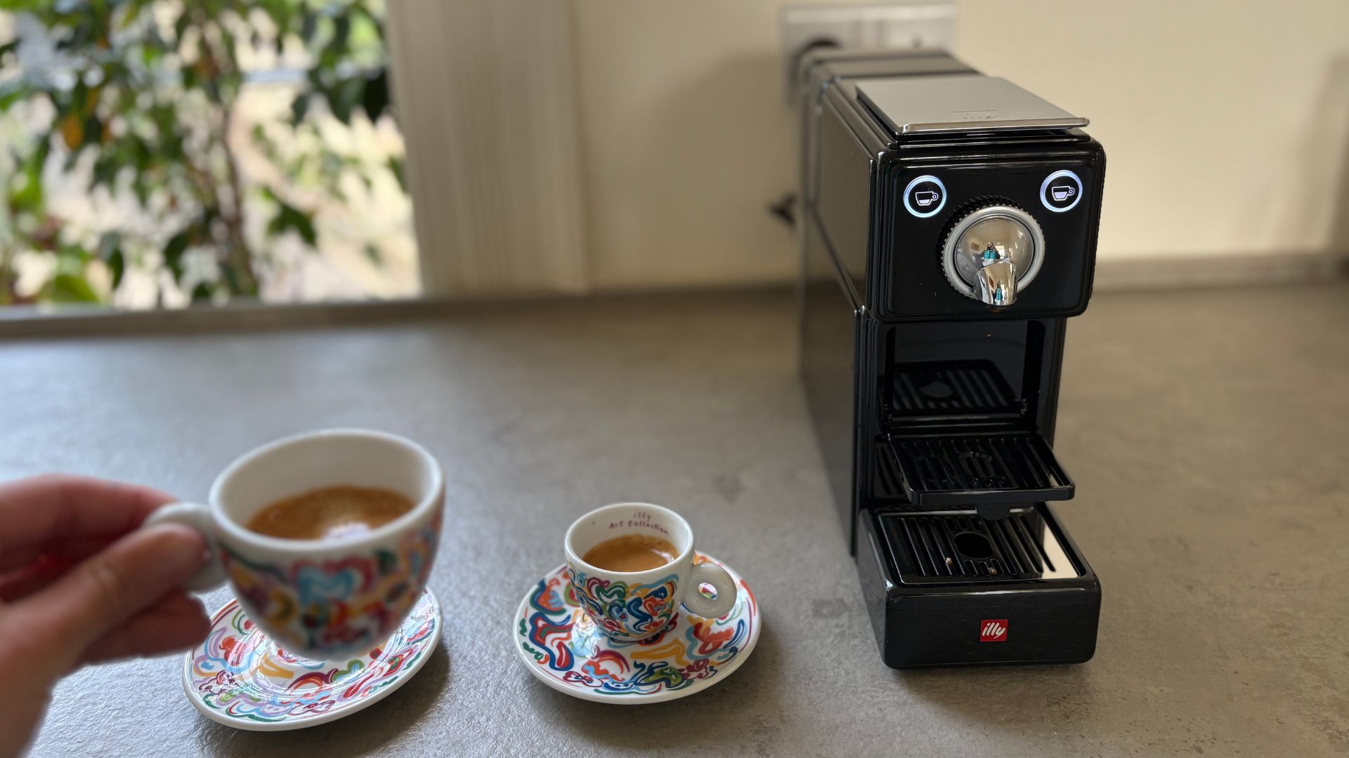 illy X3 coffee machine brewing two espressos