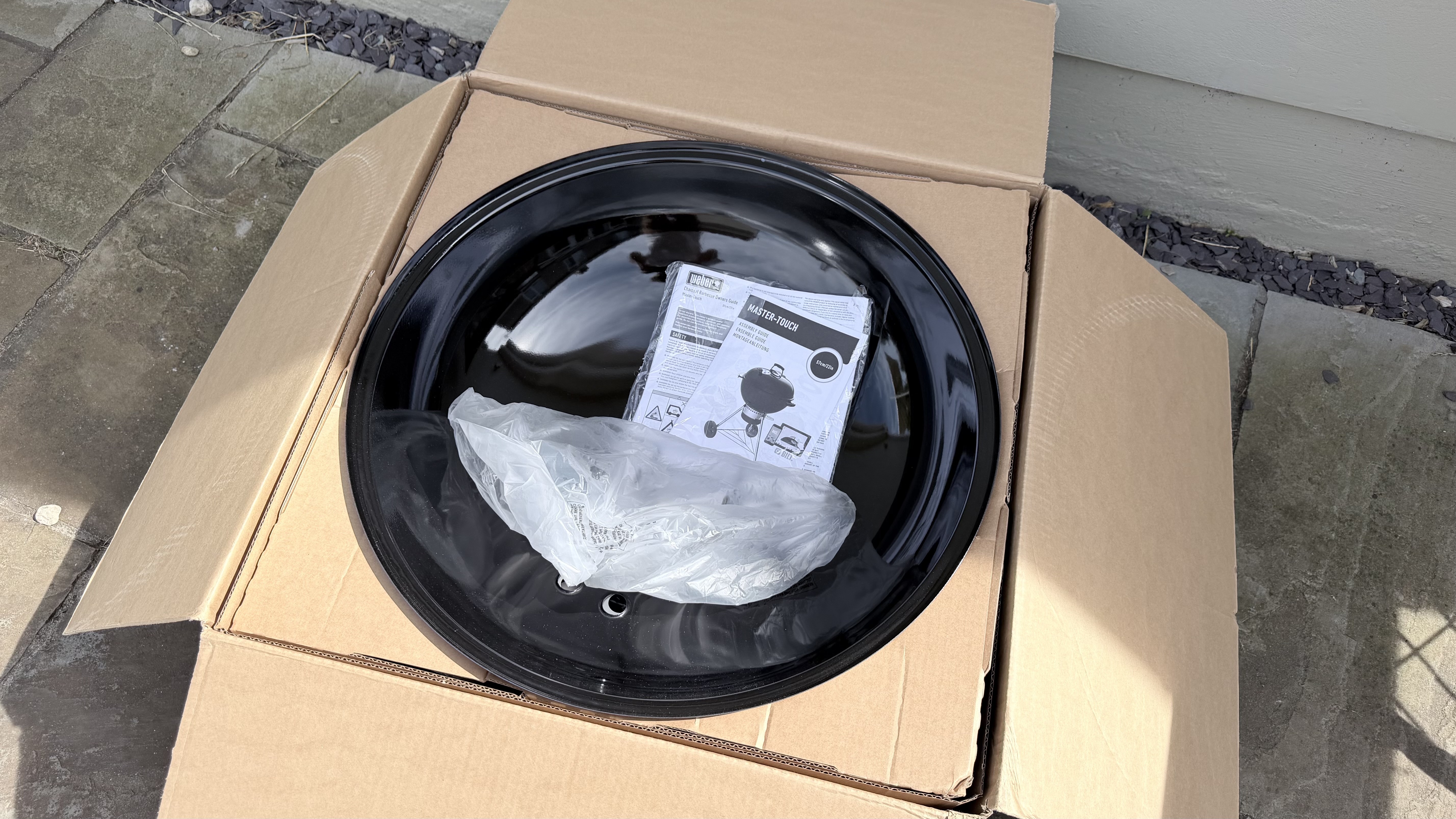 The Weber Master-Touch being assembled