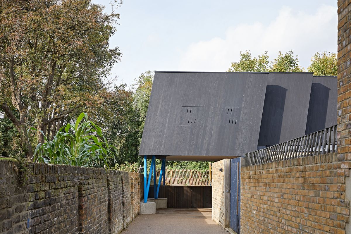 long narrow driveway with roofed car port