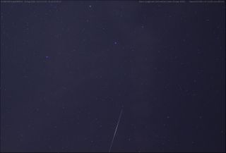 In this photo, also taken by Langbroek on Aug. 20, SPOT 6’s faint track is above and to the left of the bright X-37B trail.