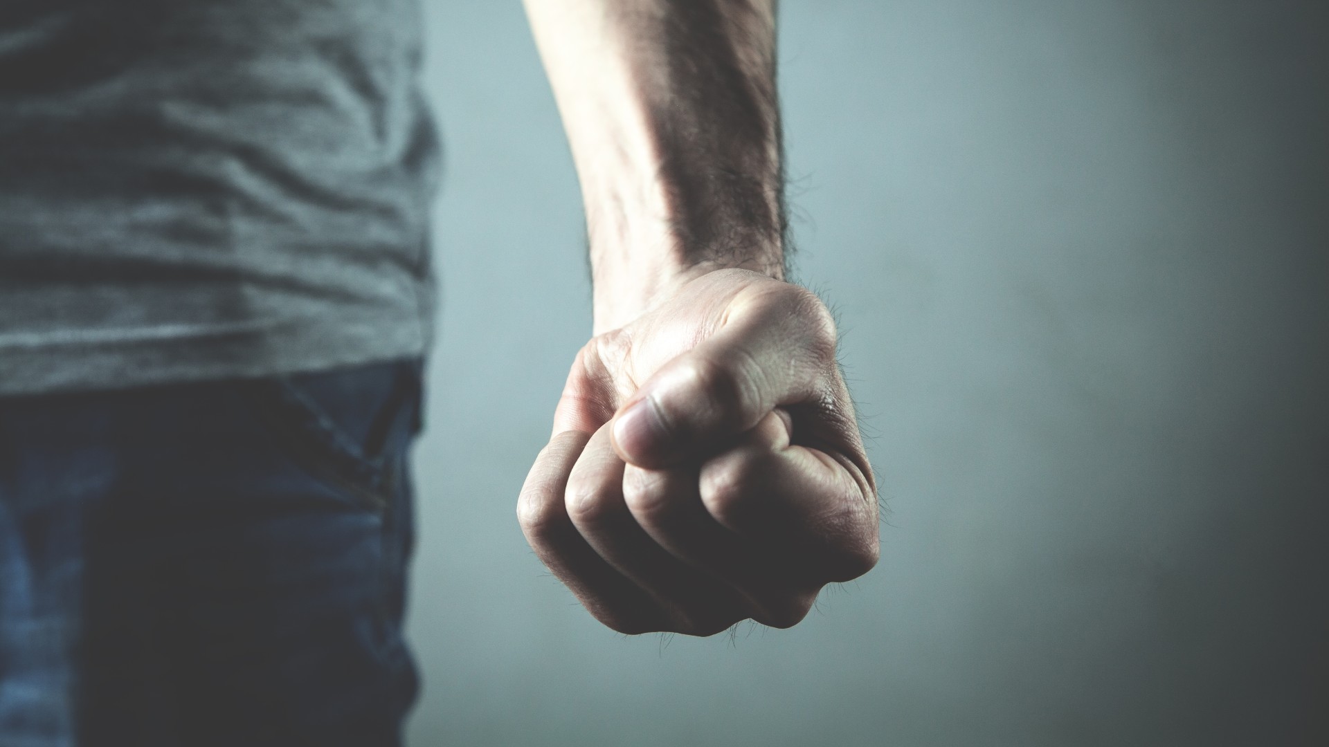 Close up of Caucasian man's angry, clenched fist