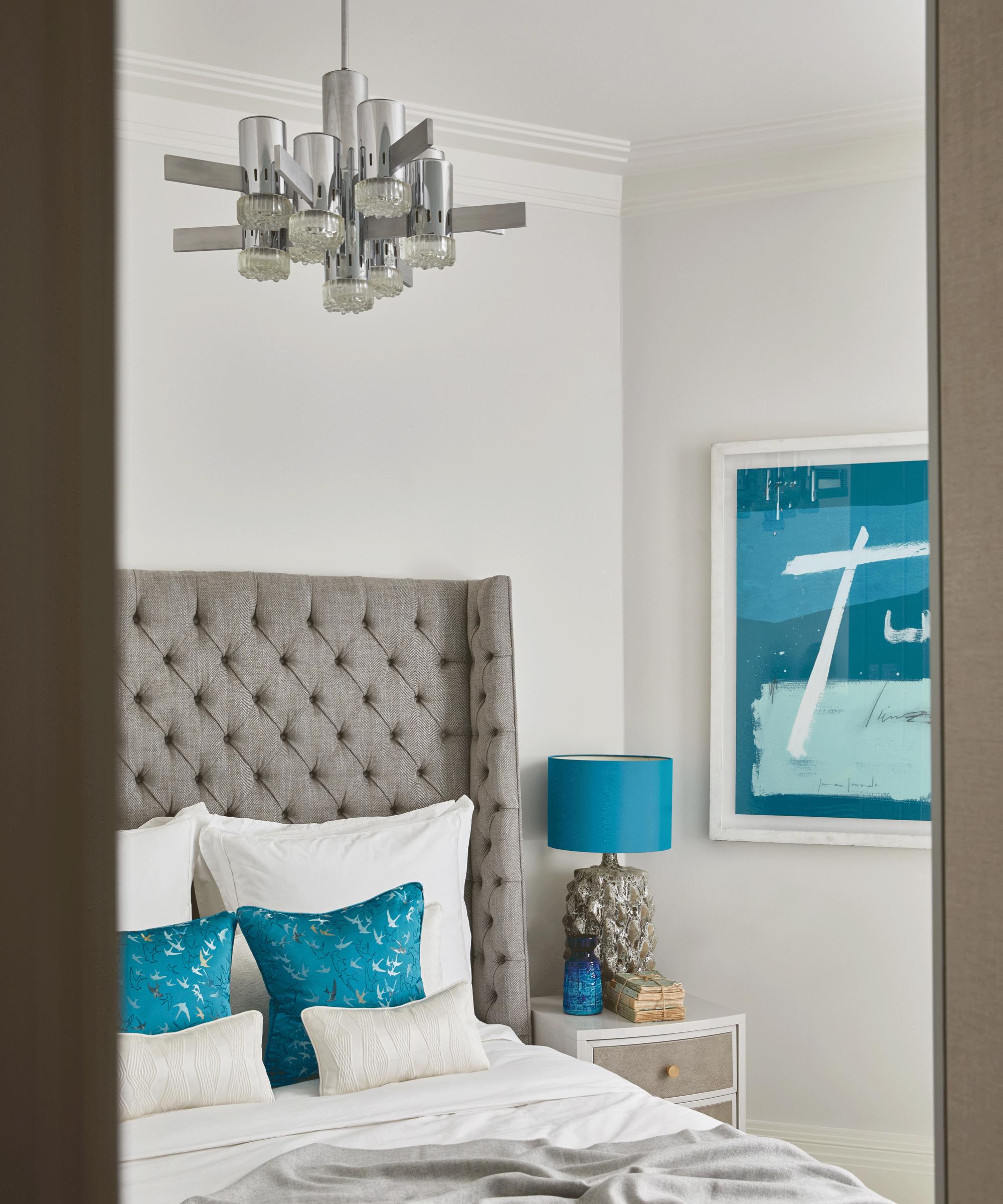 Neutral bedroom with teal accessories