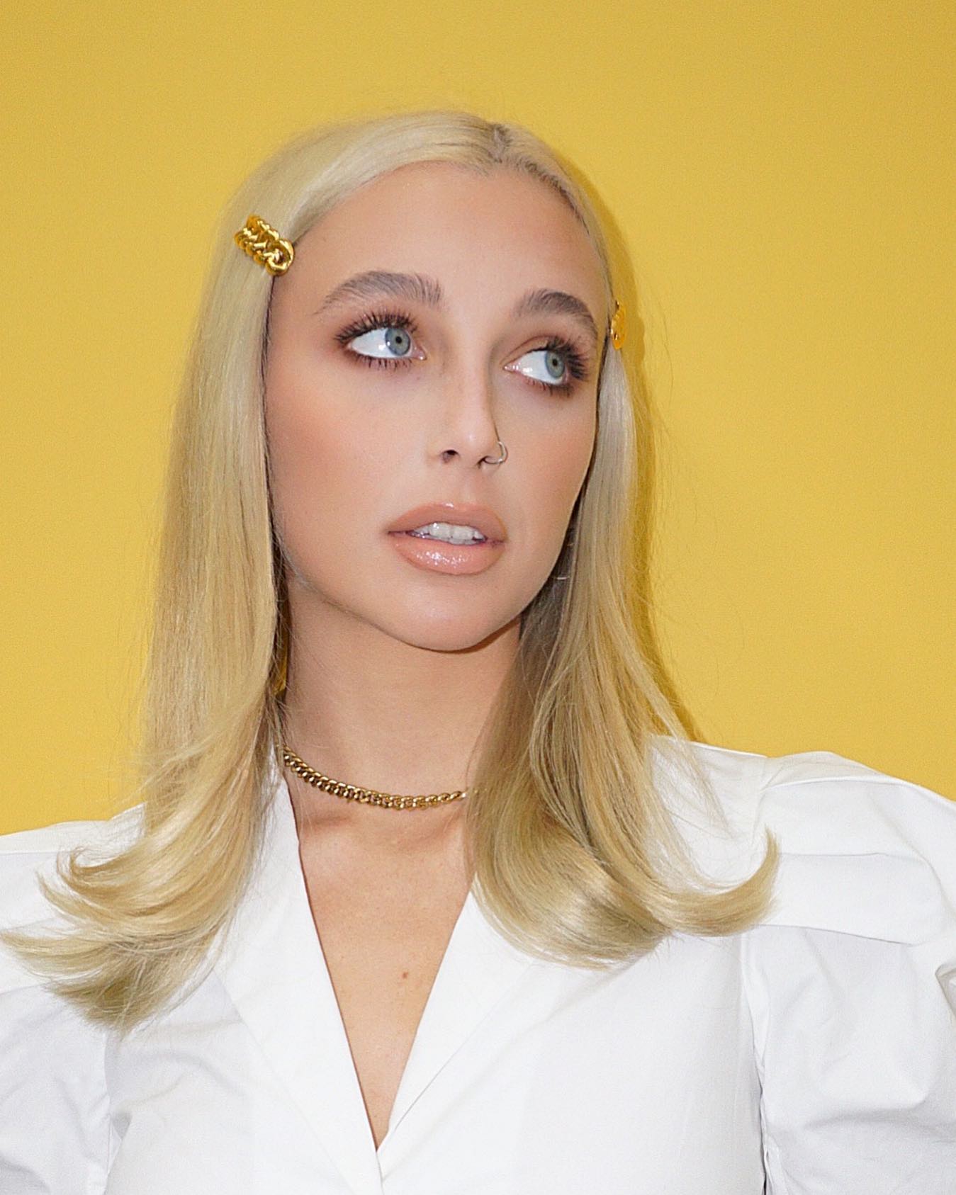 Emma Chamberlain with a flicky blonde haircut