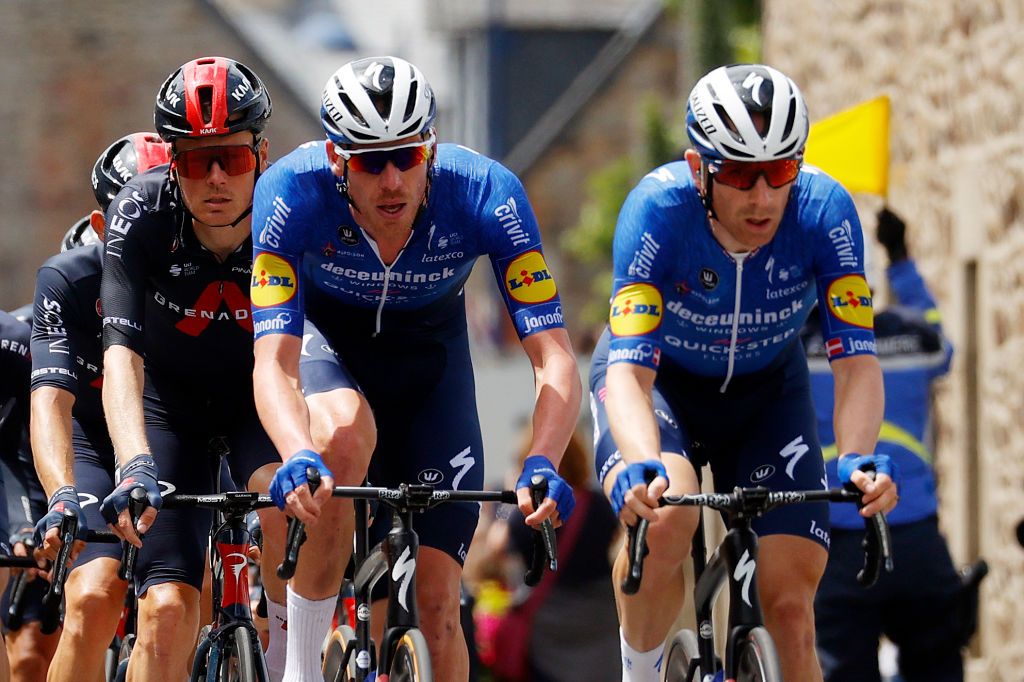 MRDEBRETAGNE GUERLDAN FRANCE JUNE 27 Tim Declercq of Belgium Michael Mrkv of Denmark and Team Deceuninck QuickStep Dylan Van Baarle of The Netherlands and Team INEOS Grenadiers leads The Peloton passing through Plouguiel Village during the 108th Tour de France 2021 Stage 2 a 1835km stage from PerrosGuirec to MrdeBretagne Guerldan 293m LeTour TDF2021 on June 27 2021 in MrdeBretagne Guerldan France Photo by Chris GraythenGetty Images
