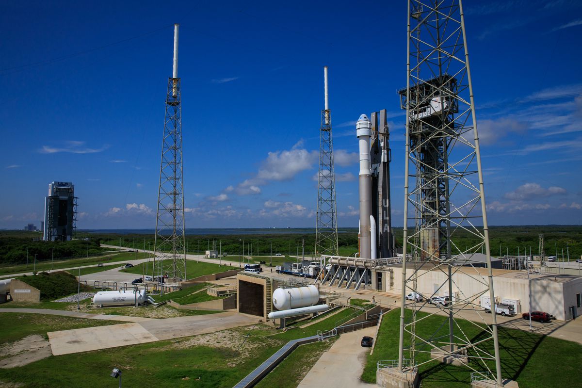 Boeing&#039;s Starliner capsule atop its Atlas V rocket as seen on the launch pad on July 29, 2021, before a launch delay and weather concerns prompted mission personnel to roll it back inside for protection.