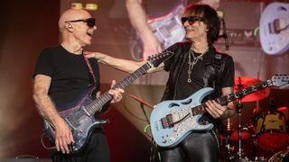 Joe Satriani (left) and Steve Vai perform onstage