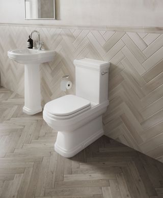 white close coupled toilet in neutral bathroom