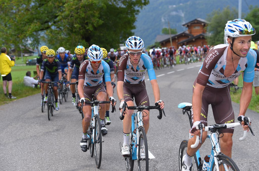 Romain Bardet is surrounded by his AG2R-La Mondiale teammates onstage 20 before the rain set in