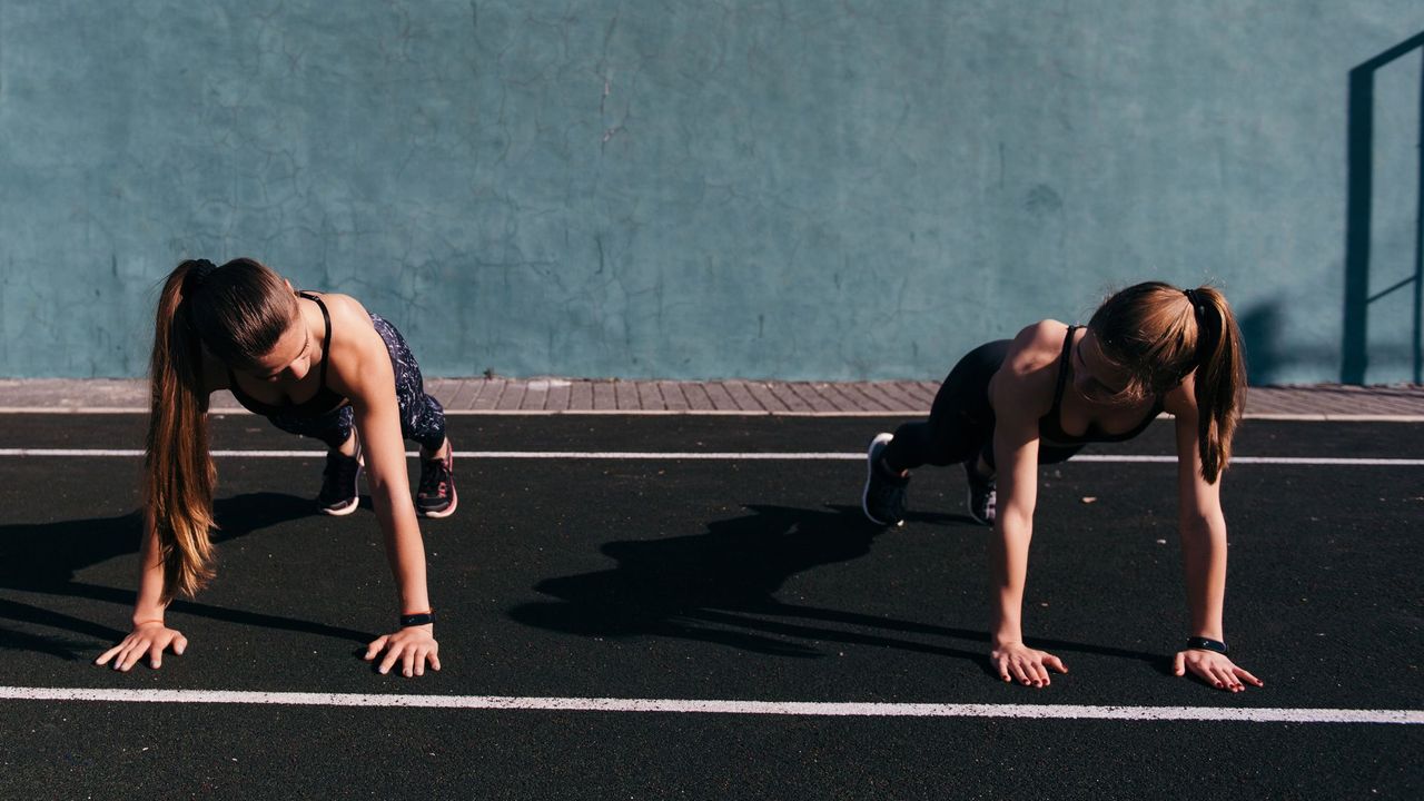 How to get motivated to workout: Two women doing push ups