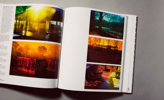 An open book with pictures of Philip Johnson's Glass House placing coloured filters in front of his digital-camera lens to create a psychedelic effect.