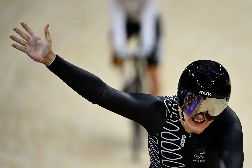 New Zealand's Ellesse Andrews celebrates after winning the women's track cycling sprint final race 2 for gold of the Paris 2024 Olympic Games at the Saint-Quentin-en-Yvelines National Velodrome in Montigny-le-Bretonneux, south-west of Paris, on August 11, 2024. (Photo by John MACDOUGALL / AFP)