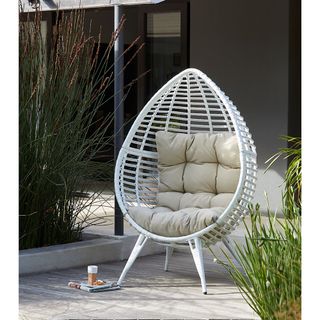 white pod chair with padded cushion
