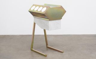 Farrand has fashioned an engine out of yellow zinc plated steel and Carrara marble