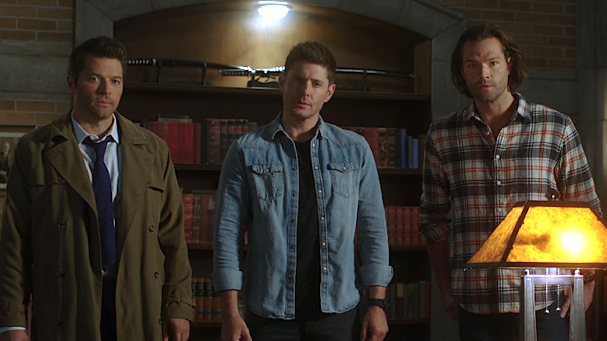 Misha Collins, Jensen Ackles and Jared Padalecki standing together in Supernatural Season 15