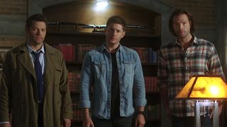 Misha Collins, Jensen Ackles and Jared Padalecki standing together in Supernatural Season 15