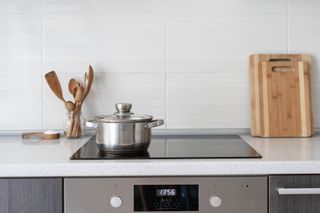 Stainless steel pot on. glass stove top