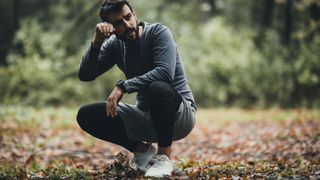 Tired trail runner taking a break