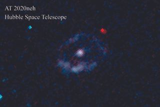 Astronomers discovered a star being ripped apart by a black hole in the galaxy SDSS J152120.07+140410.5, 850 million light years away. Researchers pointed NASA’s Hubble Space Telescope to examine the aftermath, called AT 2020neh, which is shown in the center of the image. Hubble’s ultraviolet camera saw a ring of stars being formed around the nucleus of the galaxy where AT 2020neh is located.
