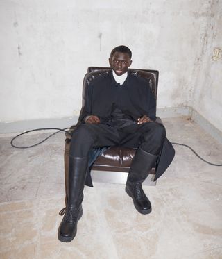 man with designer suit and leather chair