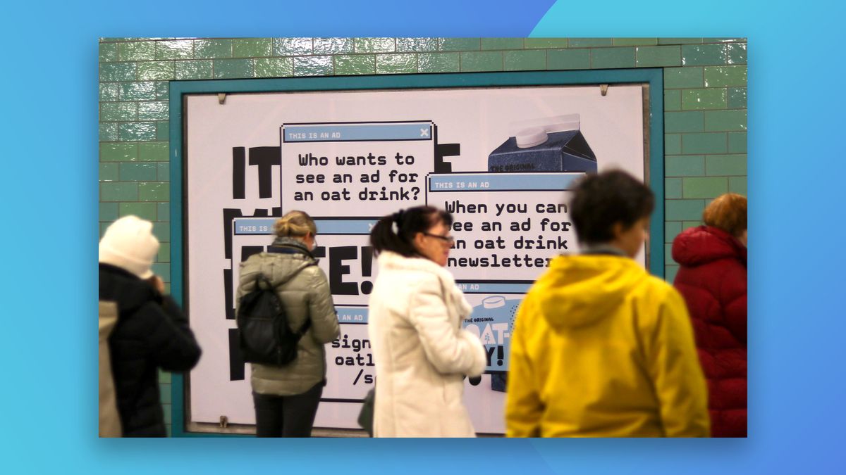 People walking past a billboard advertising Oatly&#039;s newsletter