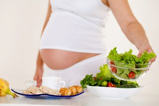 Image of a pregnant woman and healthy food