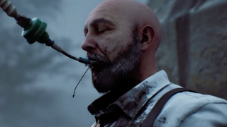 A man with a tube in his mouth closes his eyes