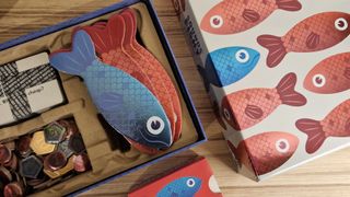 Sounds Fishy box, open on a wooden surface