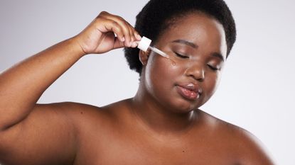 woman using one of the best face serums - getty images 1680079834