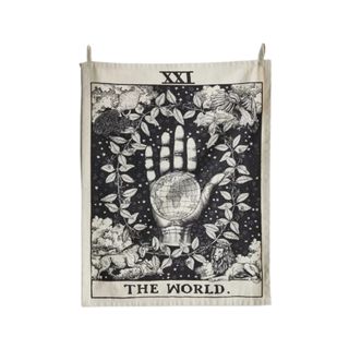 A wall tapestry with hand and plant illustrations on it