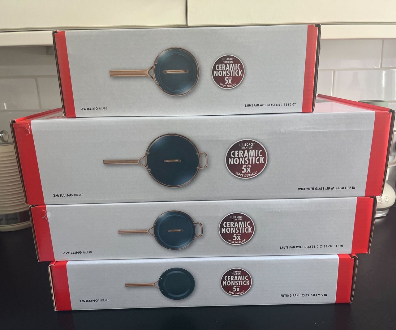 A stack of pan boxes for the Zwilling Milano Pan set