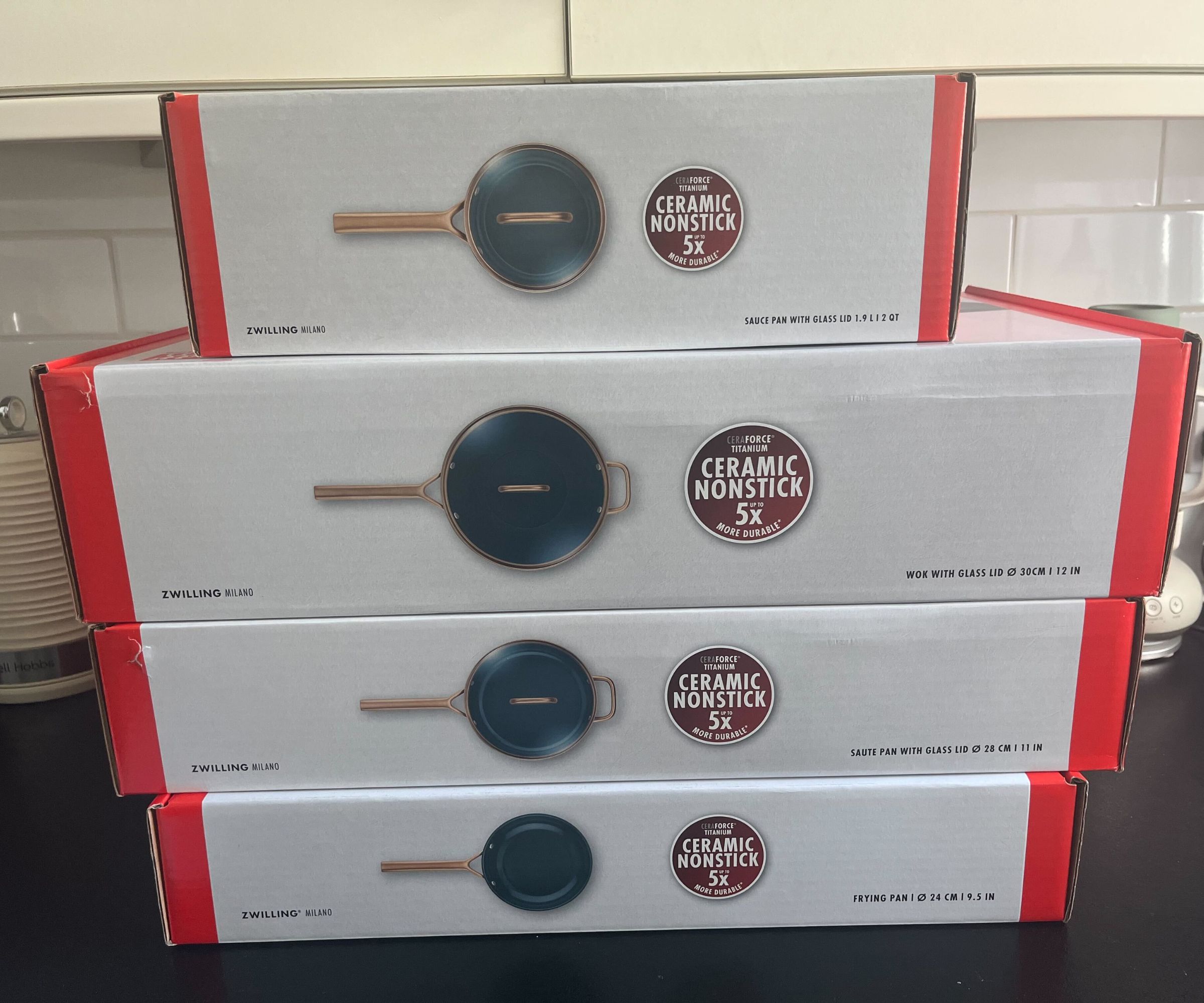 A stack of pan boxes for the Zwilling Milano Pan set