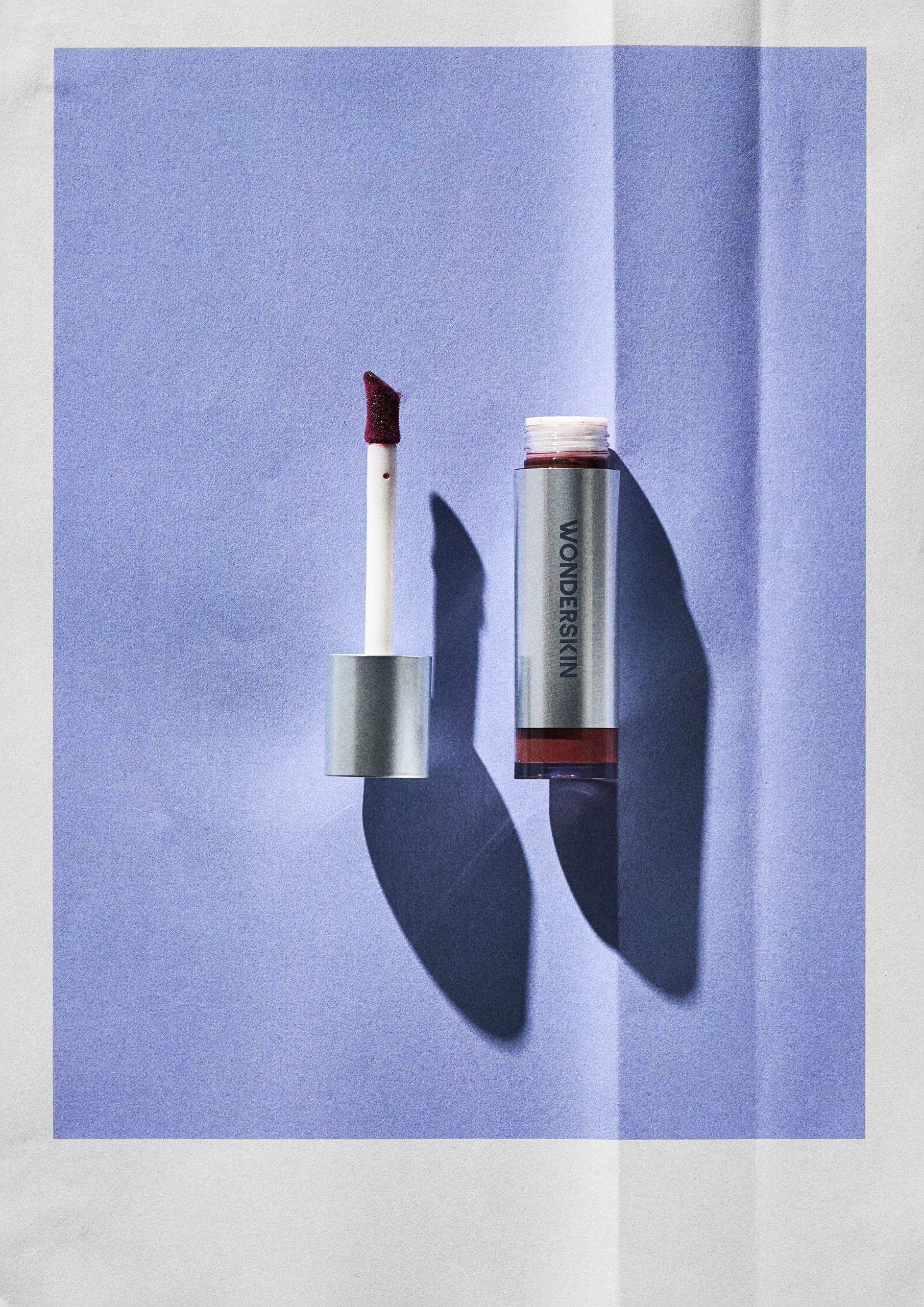 Wonderskin Wonder Blading All-Day Blush Stain on a blue background